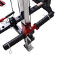 Warrior freestanding folding cable pulley power rack with red and black frame, dual pull handles, and included resistance ban