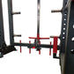 Black and red metal power rack with adjustable safety bars, spotter arms, and chrome pulleys, flat lay on white background