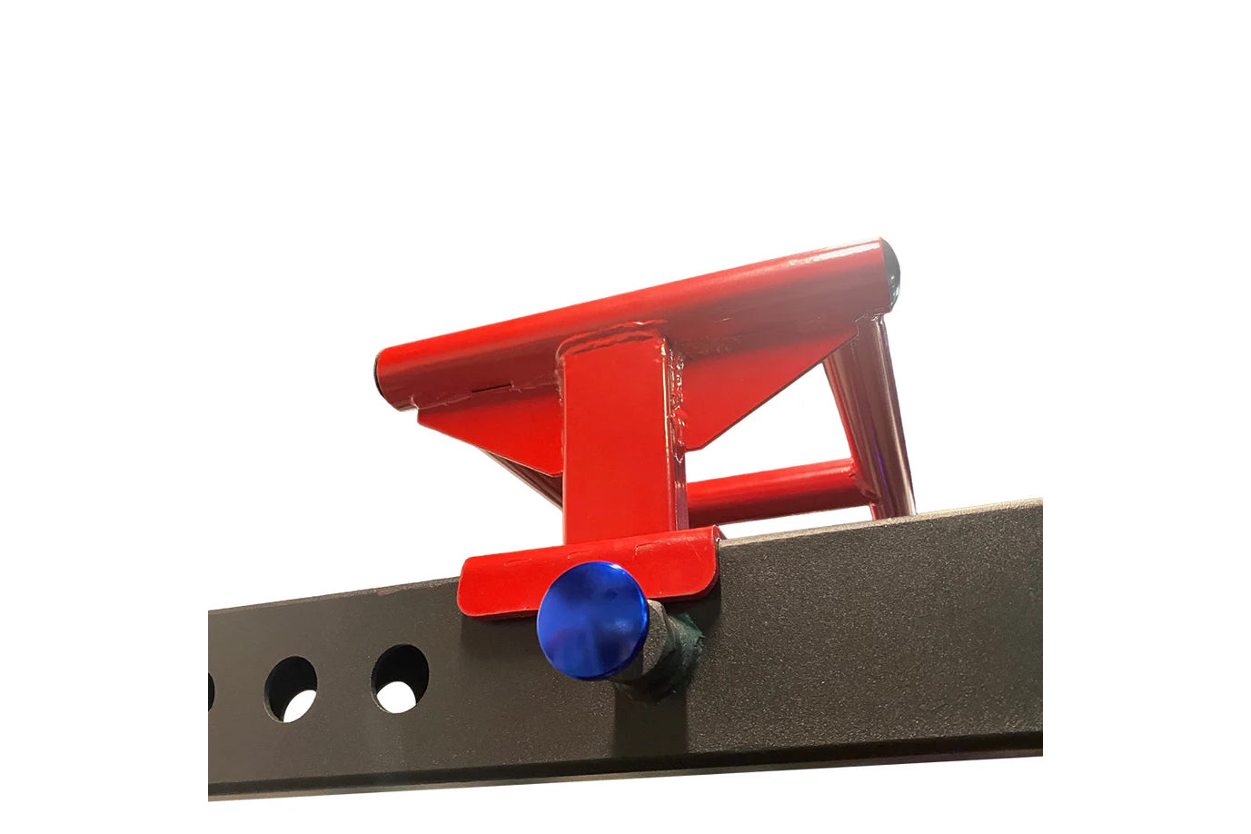 Red metal bench vise with blue knob mounted on black steel base with holes, on white background
