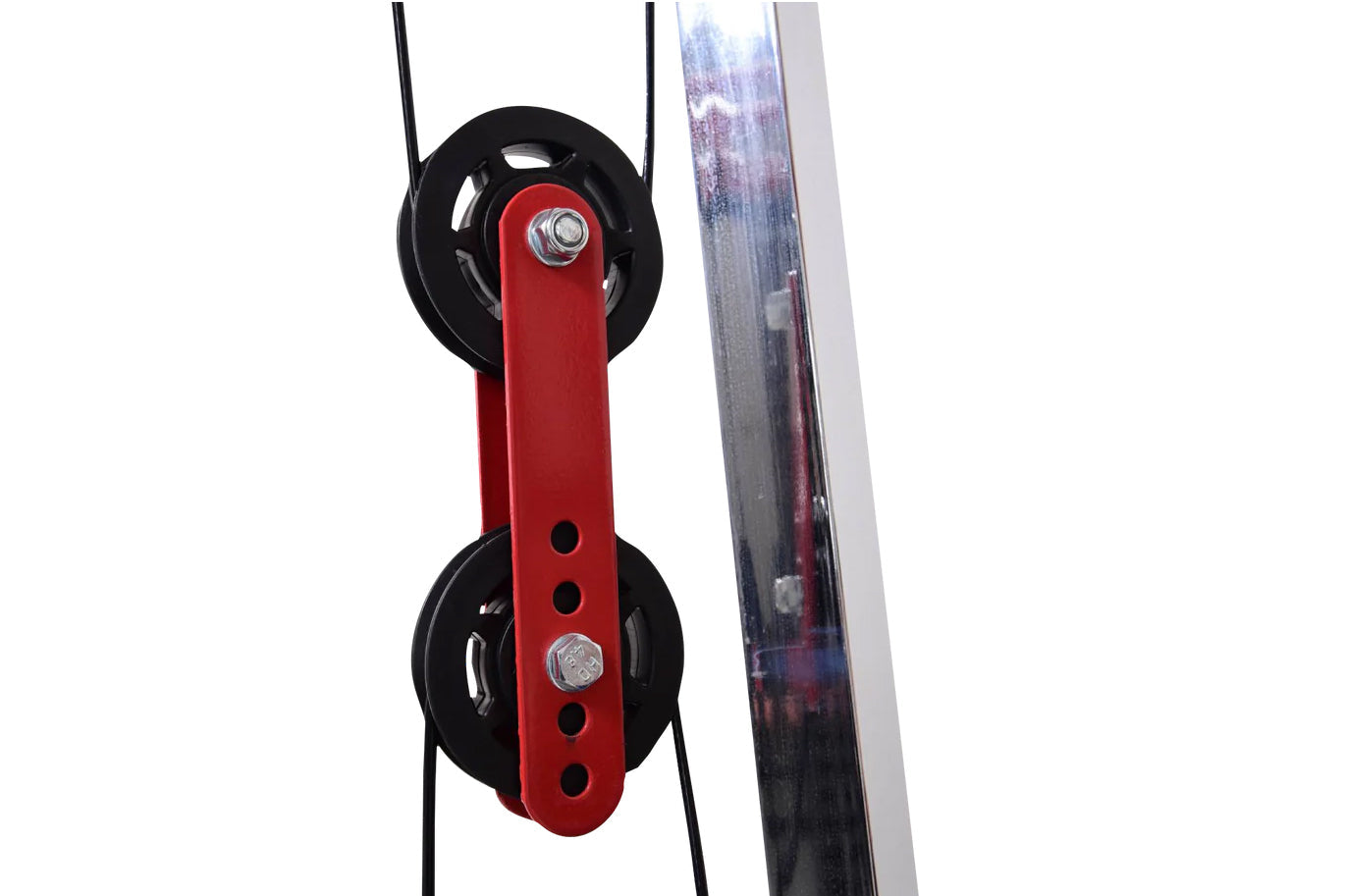 Red and black dual pulley system with metal fasteners attached to cable rack on white background