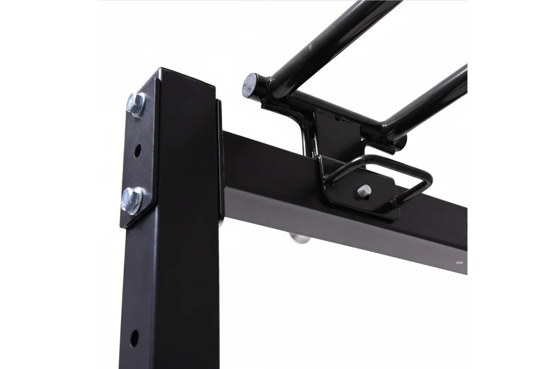 Black steel power rack with folding cable pulley system, adjustable J-hooks and safety arms on white background