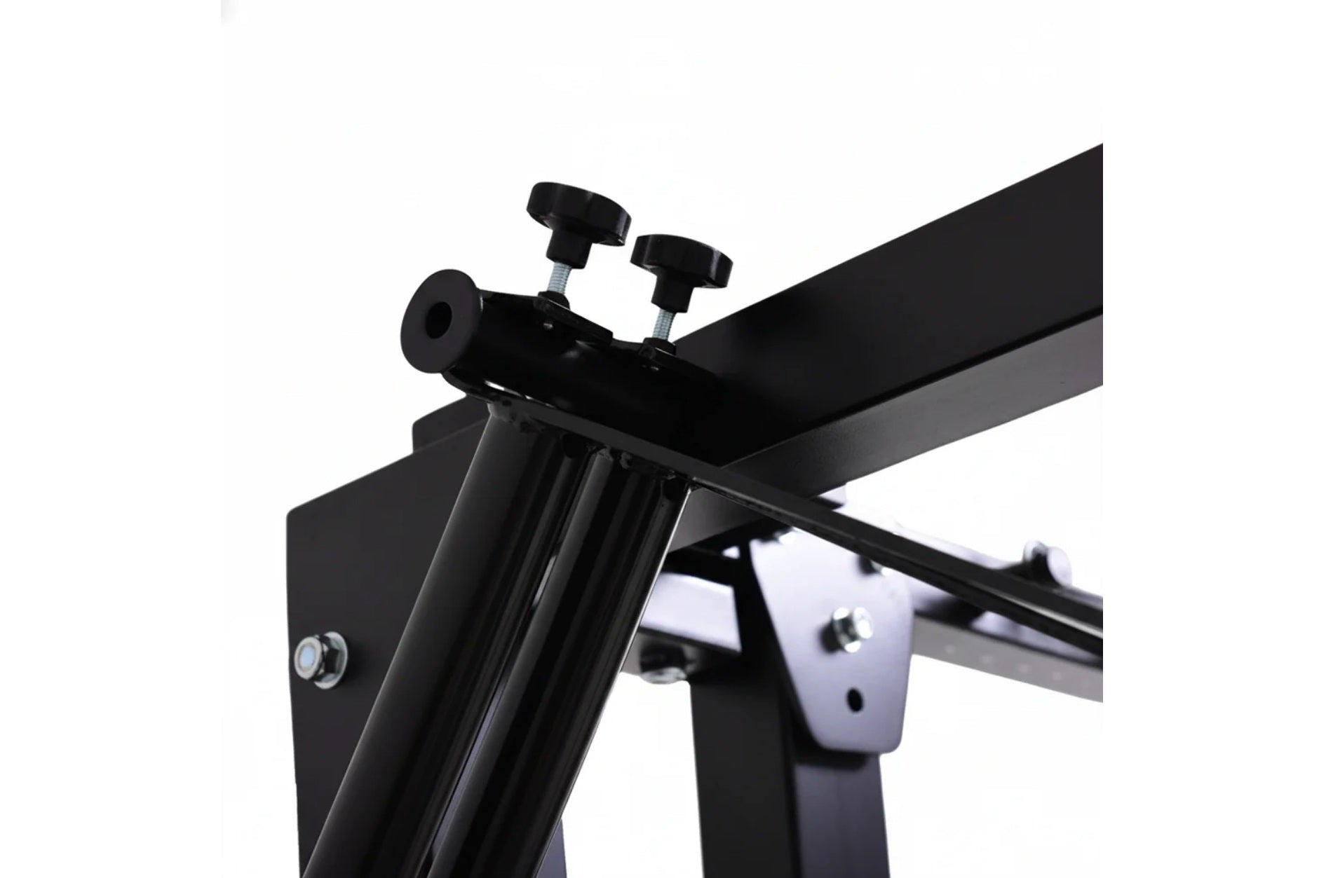 Black and white metal power rack with folding cable pulley system, adjustable height arms, and mounting hardware on white bac