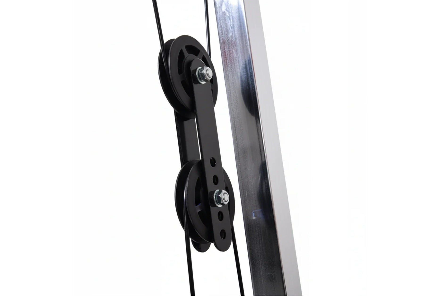 Black dual pulley system with metal attachment hardware mounted on white background