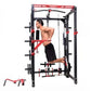 Black and red steel power rack with cable pulley system, shown with shirtless man demonstrating exercise, detachable leg pres