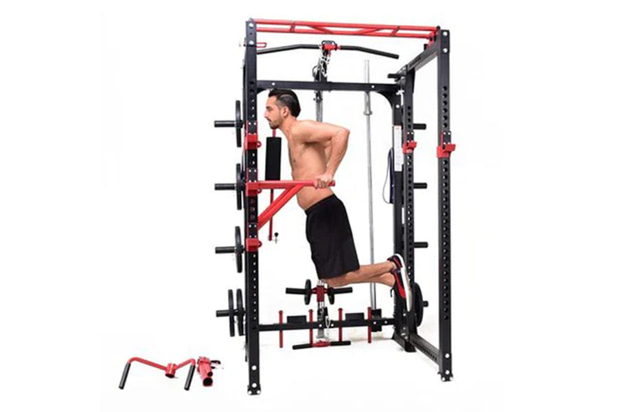 Black and red steel power rack with cable pulley system, shown with shirtless man demonstrating exercise, detachable leg pres