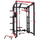 Black and red freestanding power rack with cable pulleys, lat pulldown, and leg press attachments on white background