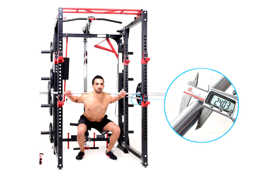 Warrior Freestanding Folding Cable Pulley Power Rack with black and red frame, shown with male model demonstrating cable fly 