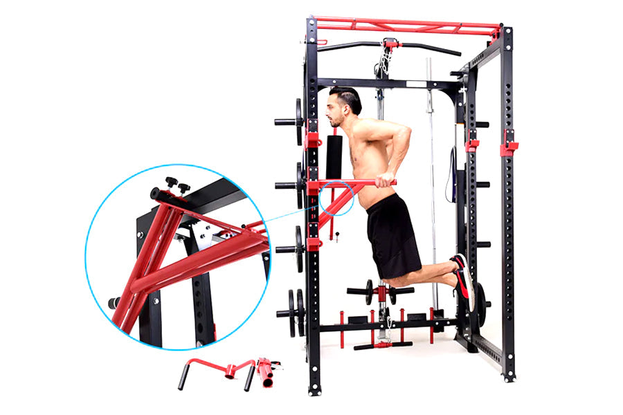 Man using red and black cable pulley power rack with adjustable pulleys and weight plates, shown in pull-up position on white