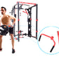 Man holding weighted plate next to black and red freestanding cable pulley power rack with red attachment detail closeup on w
