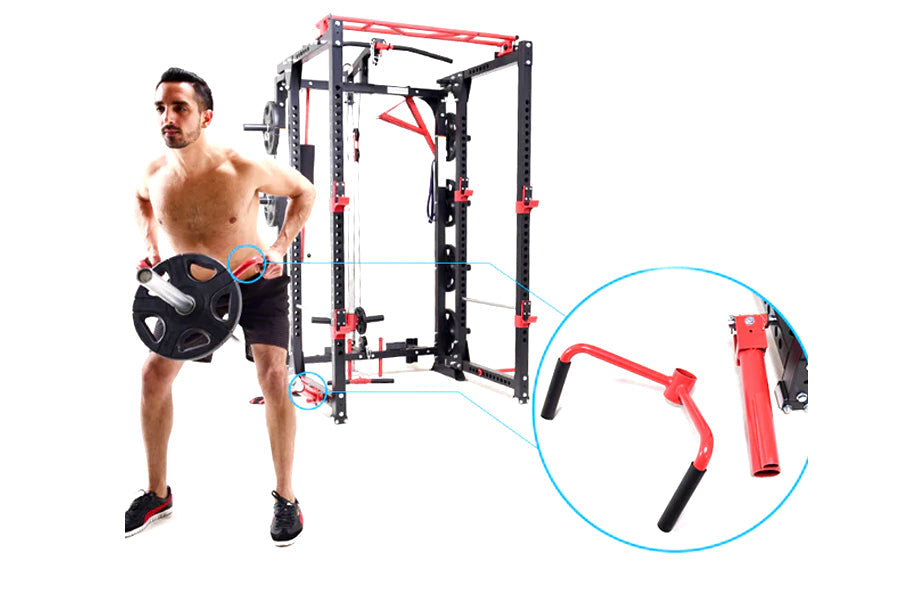 Man holding weighted plate next to black and red freestanding cable pulley power rack with red attachment detail closeup on w