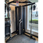 Black and white Warrior FT900 functional trainer with dual cable pulleys and adjustable handles on display in showroom