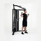 Man using black cable pulley functional trainer with dual adjustable arms on white background