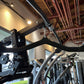 Black Warrior HG900 home gym with leg press attachment mounted on ceiling in industrial setting