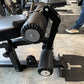 Warrior HG900 home gym leg press attachment with black metal frame, dual cylindrical footplates, and gray seat, displayed in 