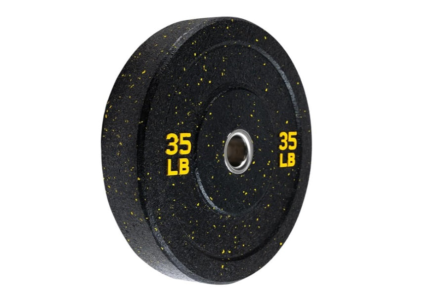 Warrior Hi-Temp 35 lb black bumper plate with yellow speckles and chrome center collar, flat lay view