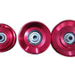 Three metallic pink skateboard wheels with steel ball bearings on white background
