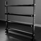 Black metal free weight storage rack with four horizontal shelves and adjustable pegs, shown against gray background
