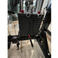 Black weight plate storage system with horizontal sled attachment, red handles, and chain cable, viewed from front on concret