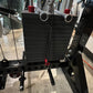 Black metal lat pulldown and low-row home gym system with stacked weight plates, chrome handles, red accents, and chain attac