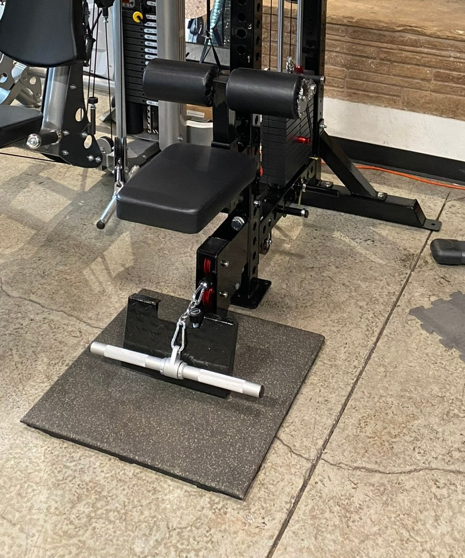 Black and silver lat pulldown and low-row home gym machine with padded seat, dual cylindrical handles, and textured base plat