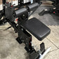 Black Warrior Lat Pulldown and Low-Row home gym system with padded seat, dual cylindrical weight stacks, and adjustable arm b