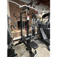 Black and white Warrior Lat Pulldown Low-Row home gym system with weight stack and adjustment pins in commercial gym setting