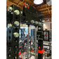 Black steel cable crossover machine with glass doors, multiple brass pulleys, and red accents, displayed in gym setting