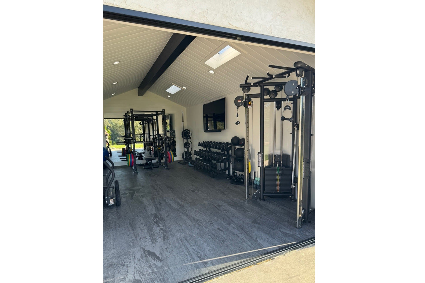 Warrior Marble Interlocking Tile Gym Flooring in cloud grey installed in modern home gym with equipment