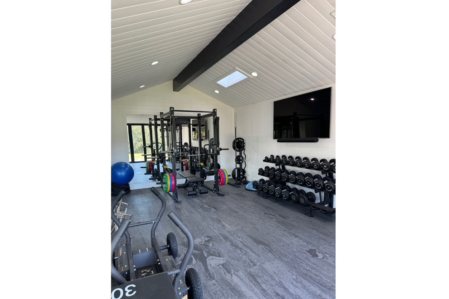 Warrior Marble Interlocking Tile Gym Flooring in cloud grey installed in modern fitness facility with equipment