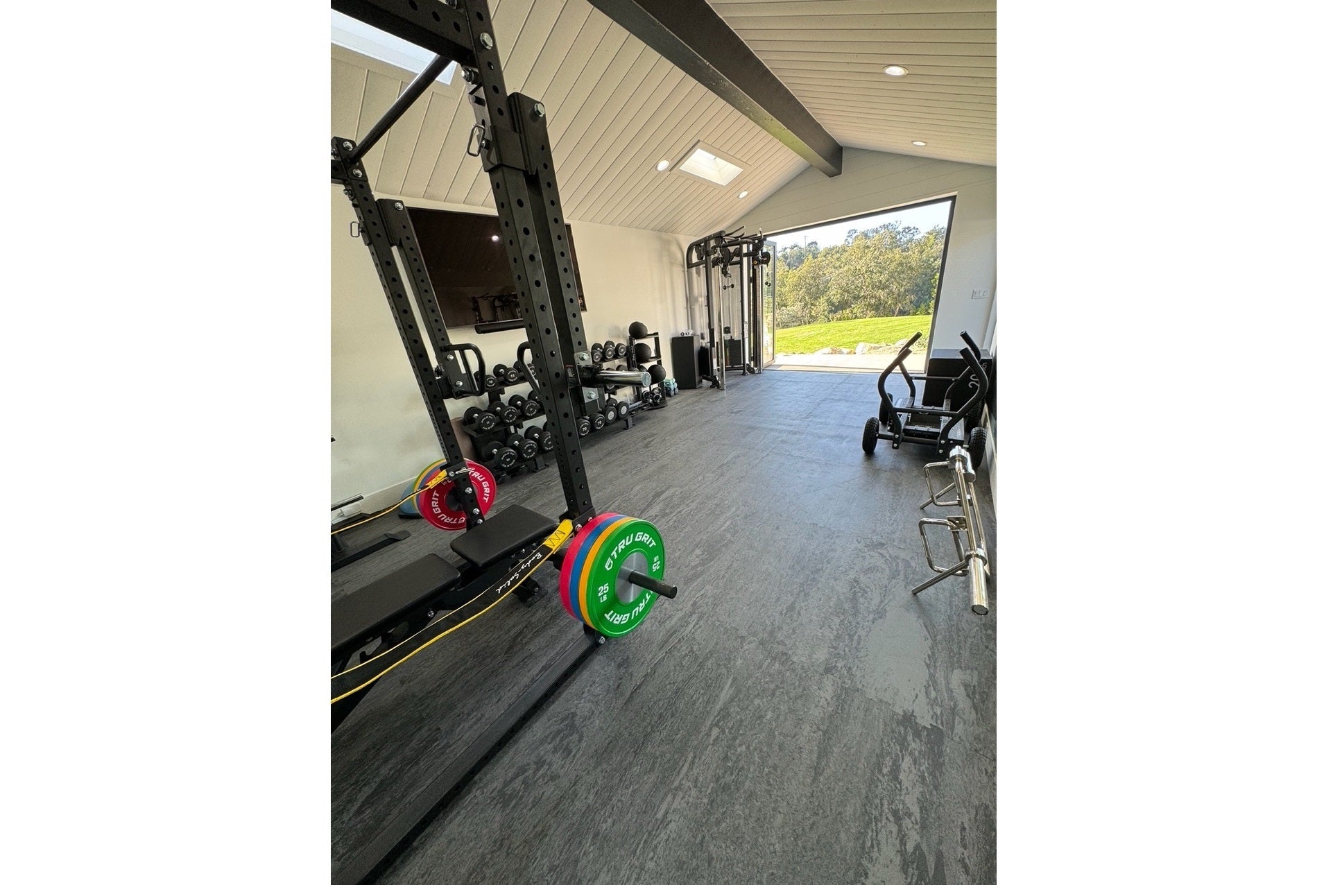 Warrior Marble Interlocking Tile Gym Flooring in Cloud Grey installed in modern home gym with equipment