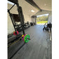 Warrior Marble Interlocking Tile Gym Flooring in Cloud Grey installed in modern home gym with equipment
