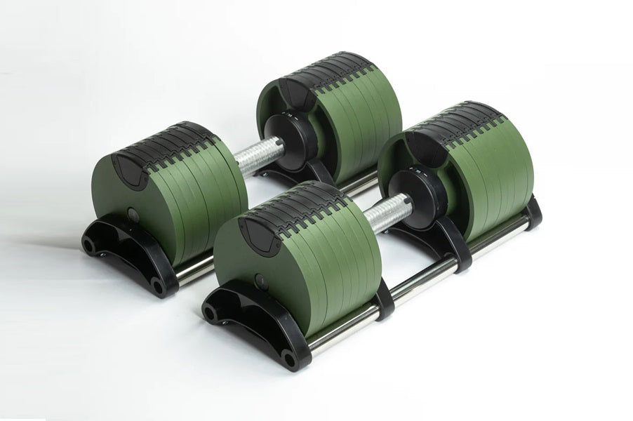 Pair of green and black adjustable dumbbells with metal handles on stand, flat lay on white background
