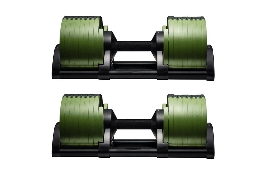 Pair of adjustable dumbbells with green ridged weight plates and black handle and base on white background