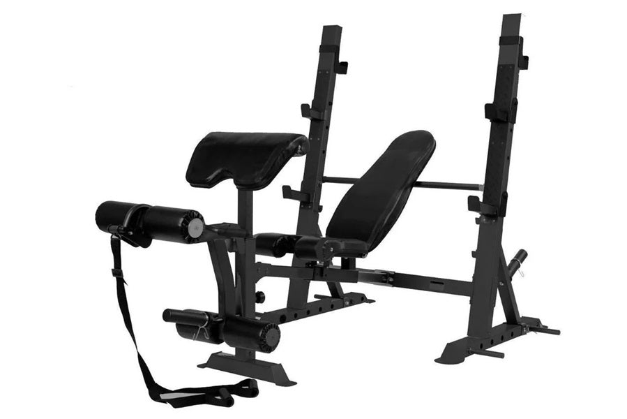 Black multi-function Olympic weight bench with adjustable backrest, leg extension attachment, and dual uprights on white back