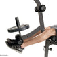 Dark gray Olympic weight bench with leg extension attachment, shown with male model demonstrating leg press position on white