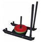 Black weight sled with red and green weight plates stacked on center post and two tall black vertical handles on white backgr