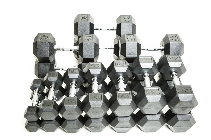 Complete hex dumbbell set with rubber-coated weights ranging from 5 to 50 pounds, displayed in rows on white background