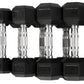Set of four black rubber hex dumbbells with chrome handles, labeled 5lb, 10lb, 15lb, and 20lb, displayed on white background