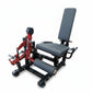 Warrior Signature commercial plate-loaded leg extension and prone leg curl machine with red frame and gray padding, on white 