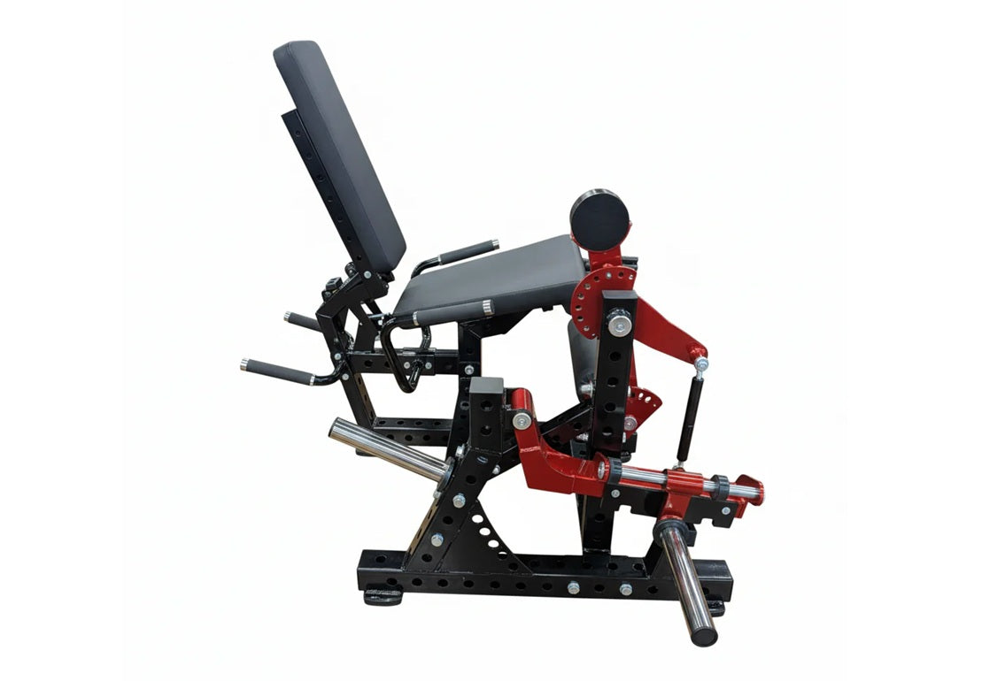 Warrior Signature commercial plate-loaded leg extension and prone leg curl machine with red and black frame on white backgrou