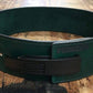 Green leather weightlifting belt with black buckle closure and metal eyelets, flat lay on wooden surface