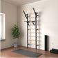 Warrior Swedish stall bars with black metal frame and natural wood rungs mounted on wall in home gym setting