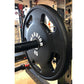 Black Warrior 45-pound urethane Olympic weight plate with grip handles, on barbell in gym setting