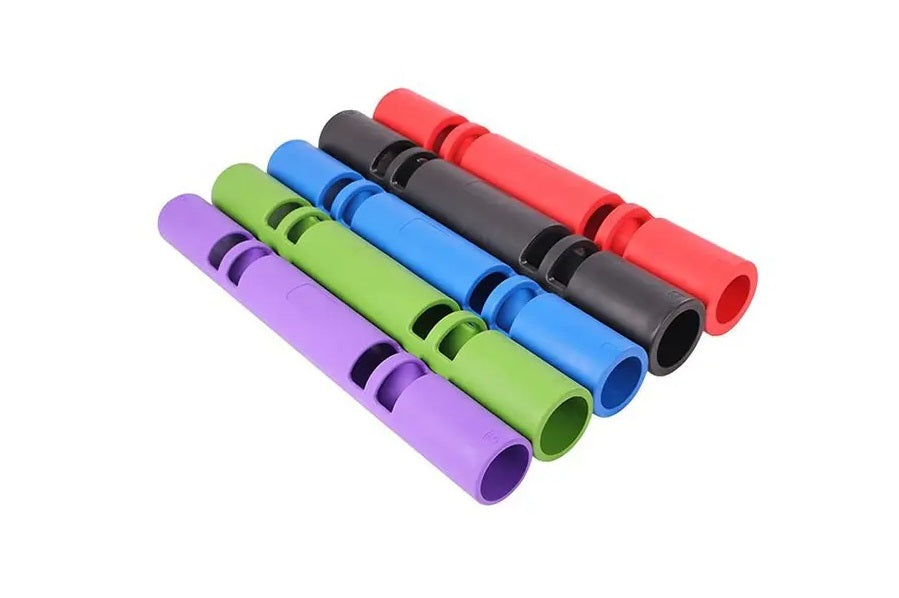 Five resistance tubes in purple, green, blue, black, and red with black grip bands, arranged diagonally on white background