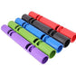 Five foam exercise tubes in purple, green, blue, black, and red with grip bands, arranged diagonally on white background