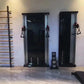 Warrior Wall Mounted Cable Pulley Home Gym System in black and silver with dual stacks, hanging handles, and workout equipmen