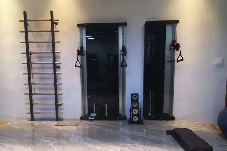 Warrior Wall Mounted Cable Pulley Home Gym System in black and silver with dual stacks, hanging handles, and workout equipmen