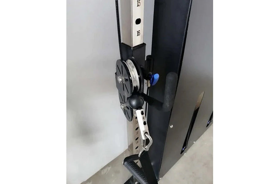Warrior black and white wall-mounted cable pulley system with dual weight stacks, metal pulleys, and blue adjustment lever on