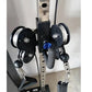 Black and silver dual pulley cable machine with metal frame, two black pulleys with white spools, blue adjustment knob, and c