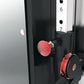 Warrior wall-mounted cable pulley home gym system with two red and black weight stacks, adjustment lever, and numbered scale 